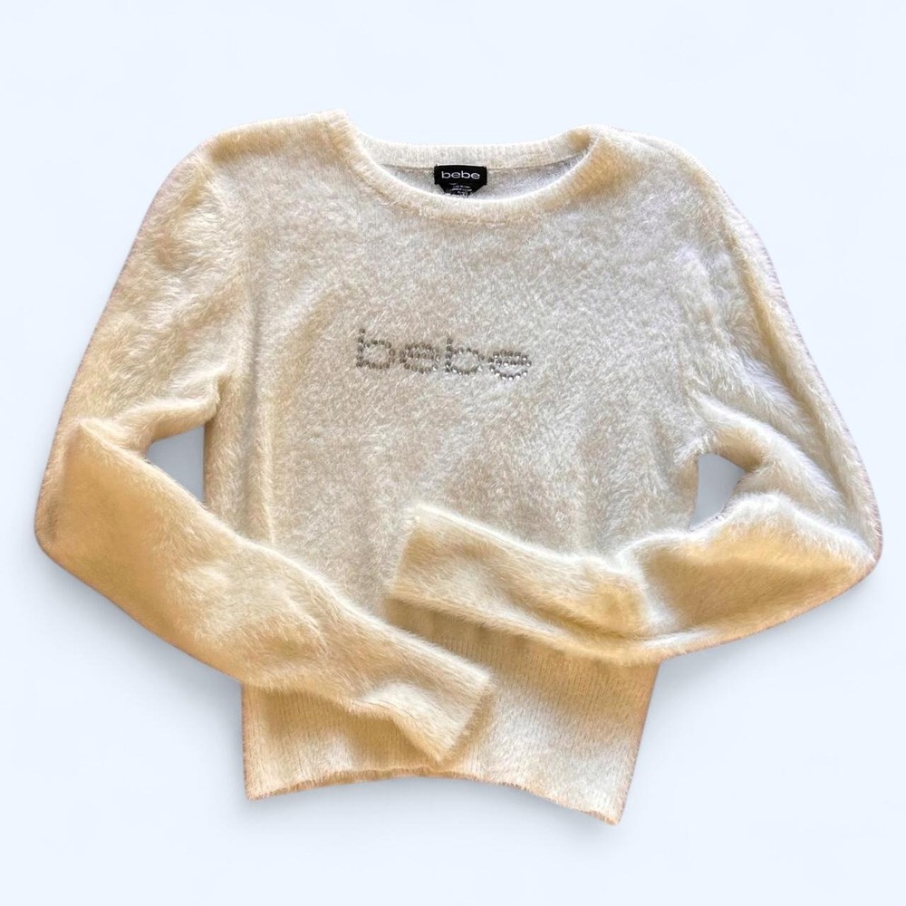 Bebe white sweater w rhinestone logo size: M